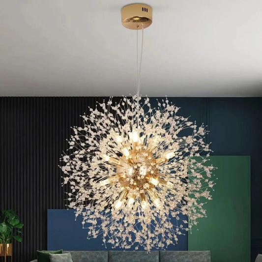 Chandelier hanging in a room with a dark wall and green plant