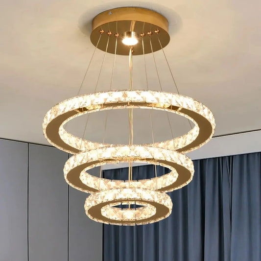 Chandelier with three circular rings hanging from the ceiling