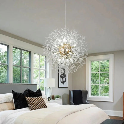Modern bedroom with a large chandelier, bed, and windows