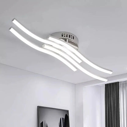 Modern ceiling light fixture in a room with white walls and a window